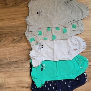 Carter's 9-month set of green, grey, and navy onsies.